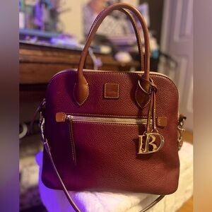 Rooney and Burke pebble grain domed satchel in red.